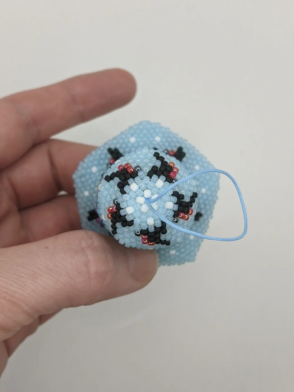 Handcrafted Light Blue Beaded Bell Ornament with Floral Accents